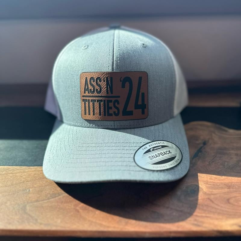 A** & Ti**Es Trucker Hat * Free Koozie